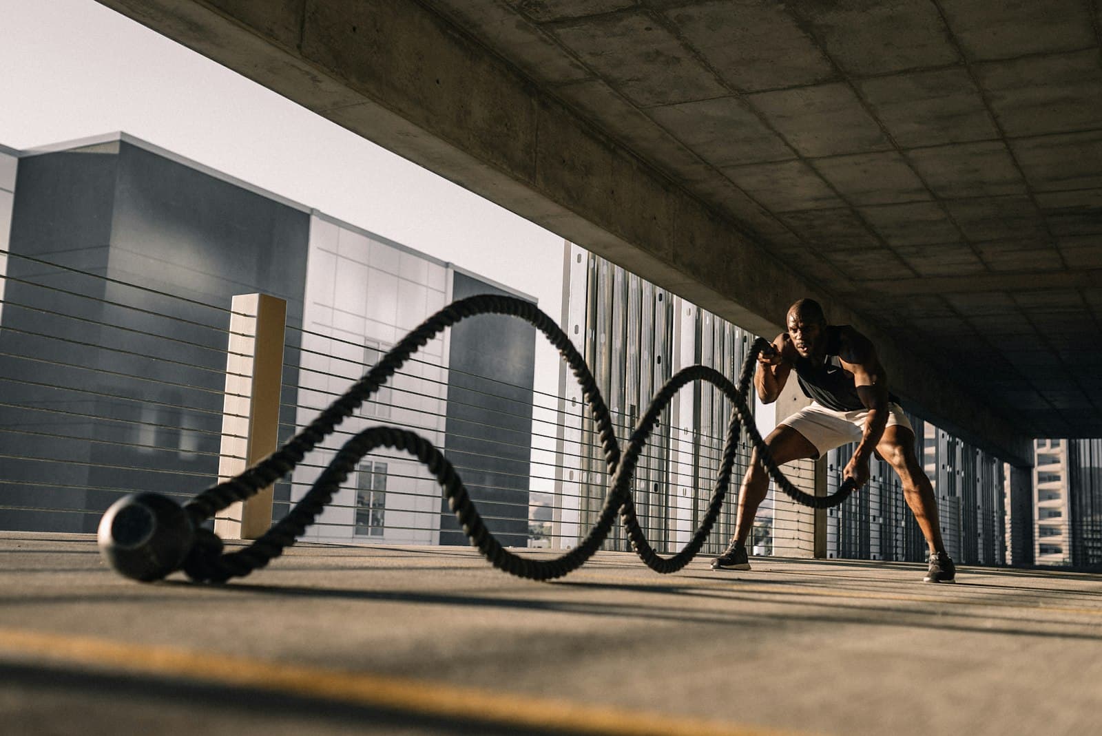 Battle ropes drill outside the studio in golden hour light